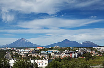 volcanoes rise above the city